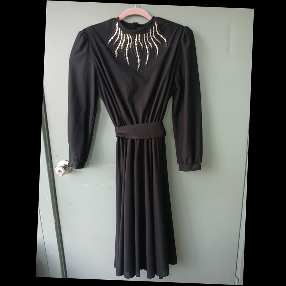 Elegant Black Dress with Embellished Neckline